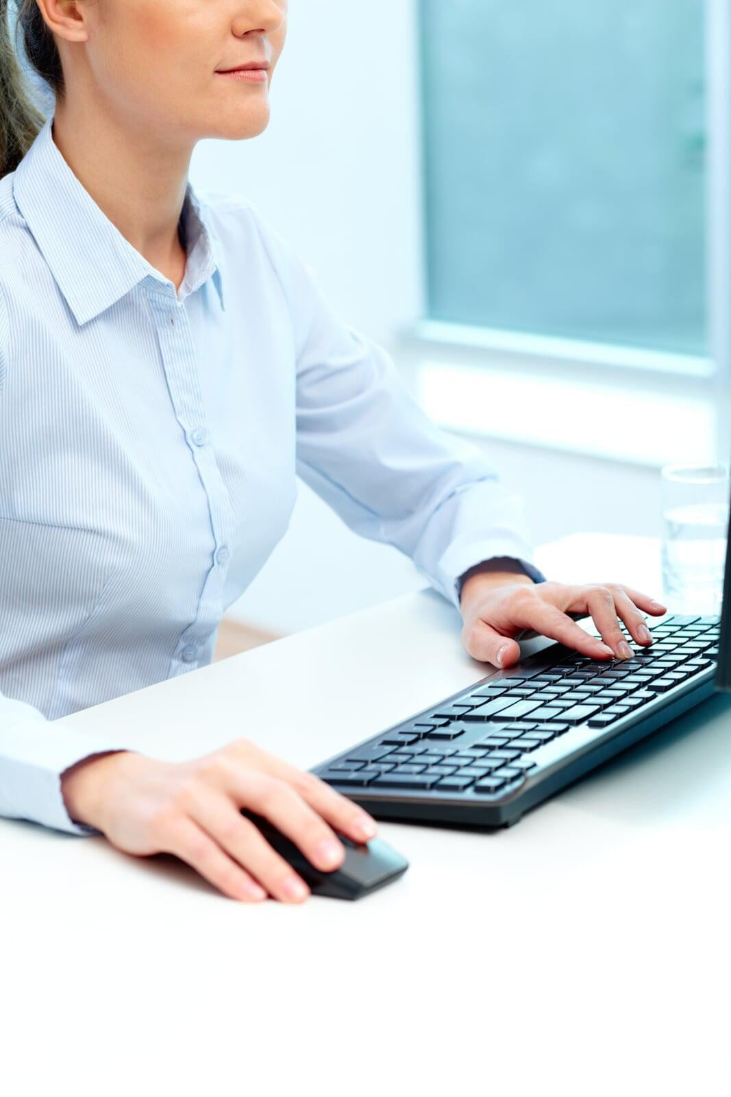 Female Typing on Keyboard